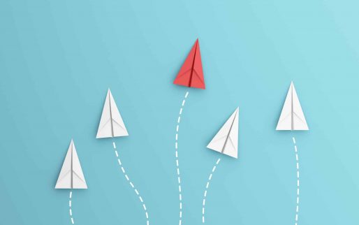 leadership or different concept with red and white paper airplane path and route line on blue background. Digital craft in education or travel concept. Mock up design. 3d abstract illustration