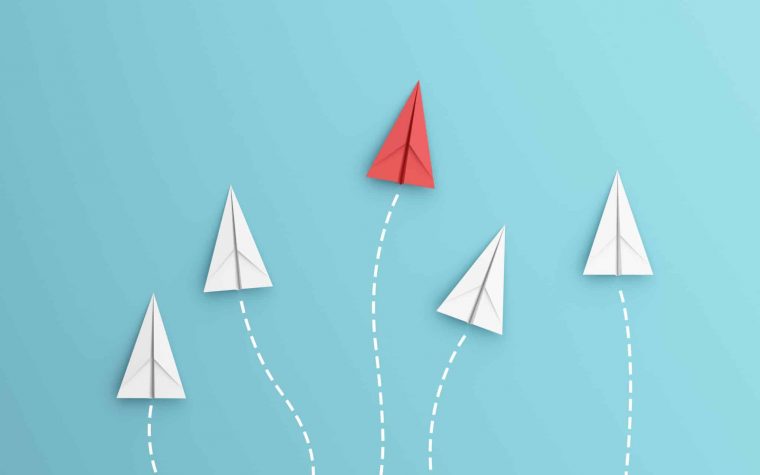 leadership or different concept with red and white paper airplane path and route line on blue background. Digital craft in education or travel concept. Mock up design. 3d abstract illustration