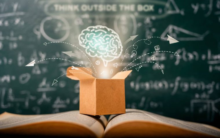 think outside the box on school green blackboard . startup  education concept. creative idea. leadership.