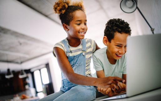 Happy children using laptop to learn, play, fun. Child, technology concept