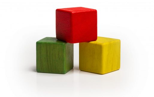 toy wooden blocks stack, pyramid of blank multicolor box cube over white background