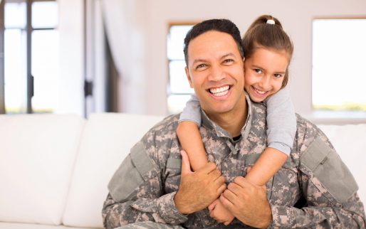 beautiful little daughter and military father at home