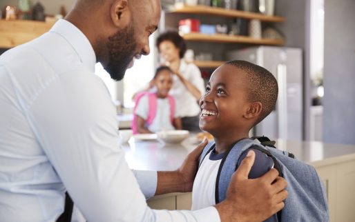 Father Saying Goodbye To Son As He Leaves For School