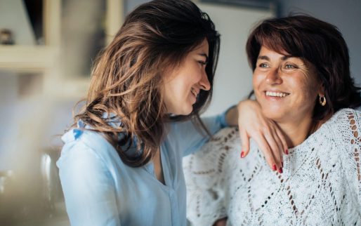 two-women-smiling-at-each-other-3893732
