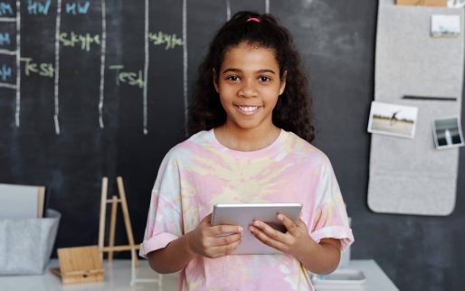 woman-in-pink-crew-neck-t-shirt-holding-tablet-computer-4144038