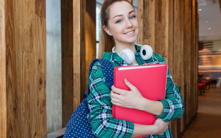 woman-standing-in-hallway-while-holding-book-1462630 (1)